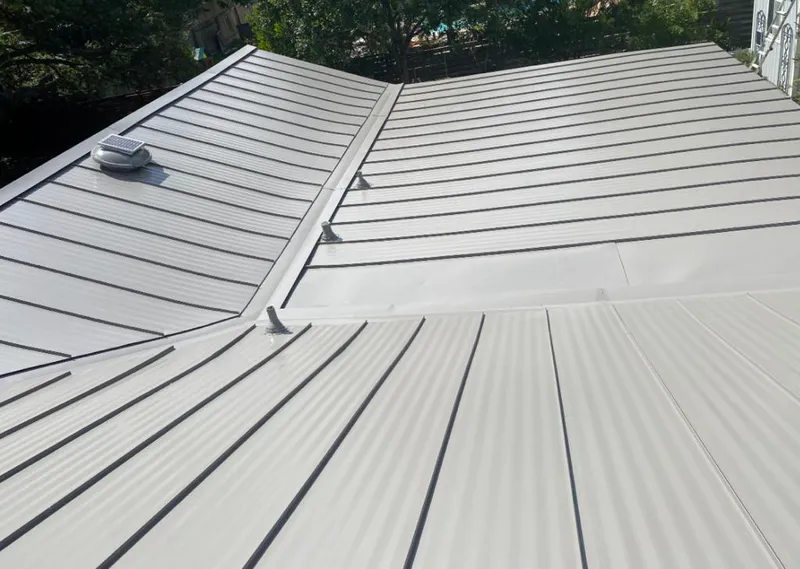 Solar attic fan installed on a metal roof for Roof Ventilation in Pleasant Hills